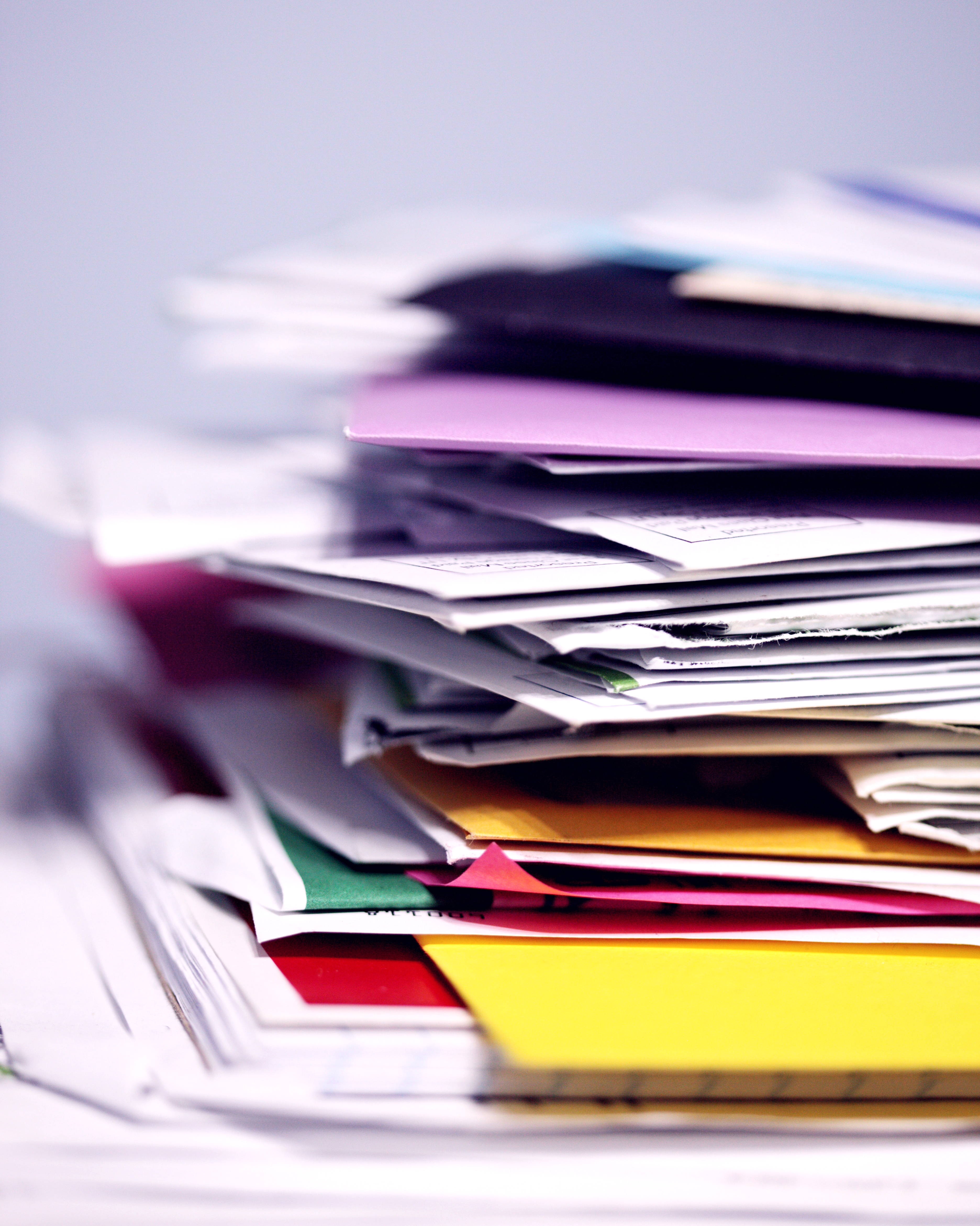 A Stack of Messy Papers Close-up on a Desk
